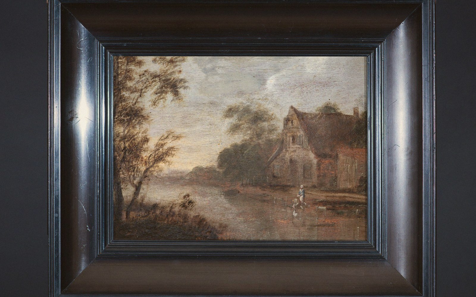 Raking light across an old painted panel, craquelure visible