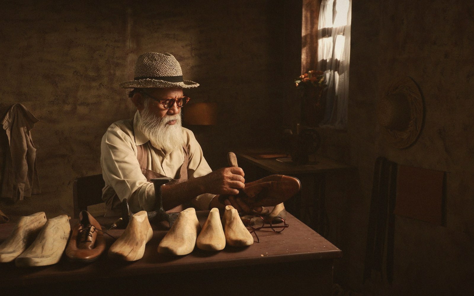 A workshop bench of half-finished wooden shoe lasts